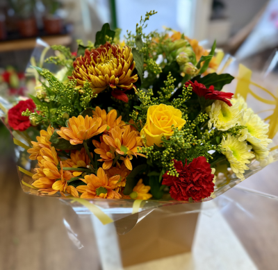 Autumn Twist - A bespoke handtied bouquet in golden autumnal shades will be delivered filled with a fabulous selection of freshly picked blooms in the signature colours of the season.